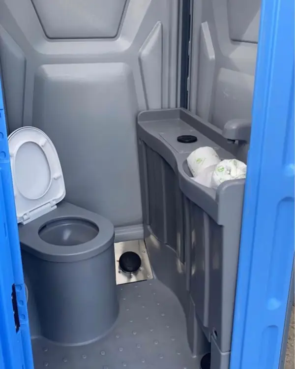 Deluxe porta potty interior with sink