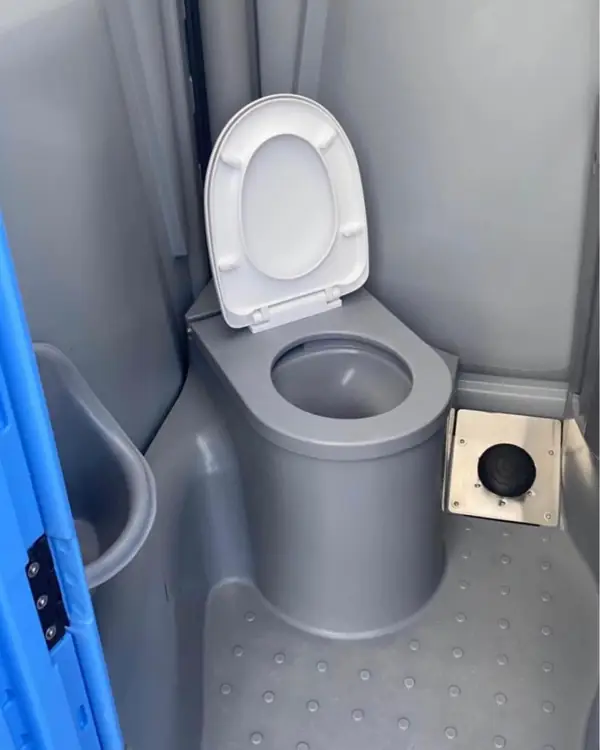 Seat and grab bar inside a portable toilet